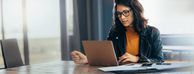 Professional woman at a computer researching ICRHA