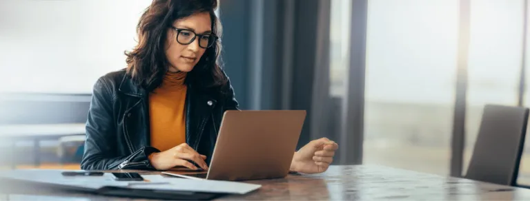 Professional woman at a computer researching ICRHA