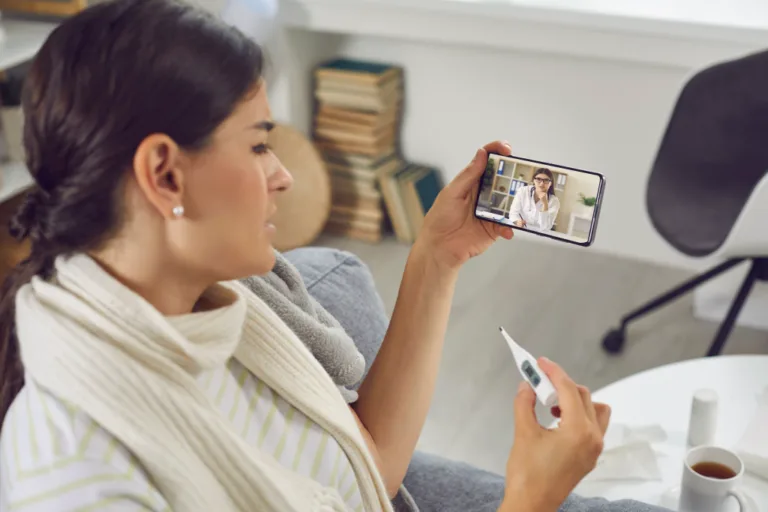 Woman on the phone with virtual urgent care